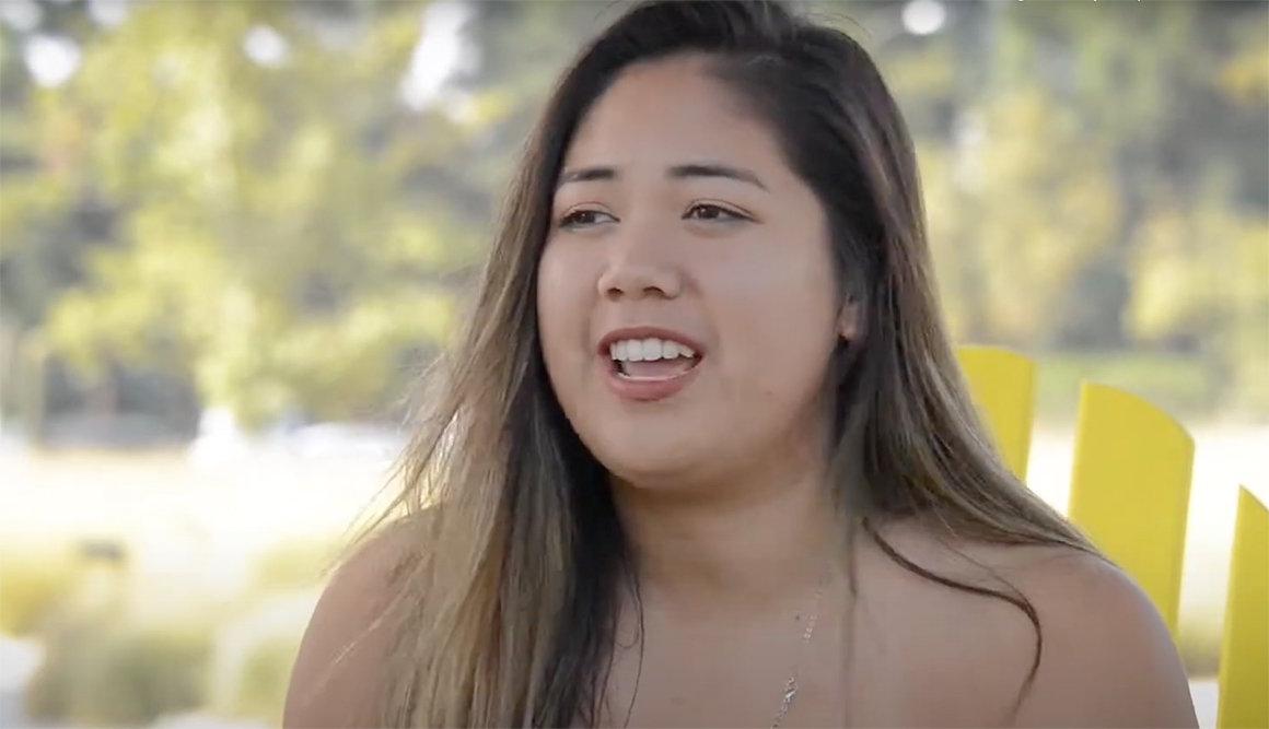 a pitzer student sits on the mounds during an interview